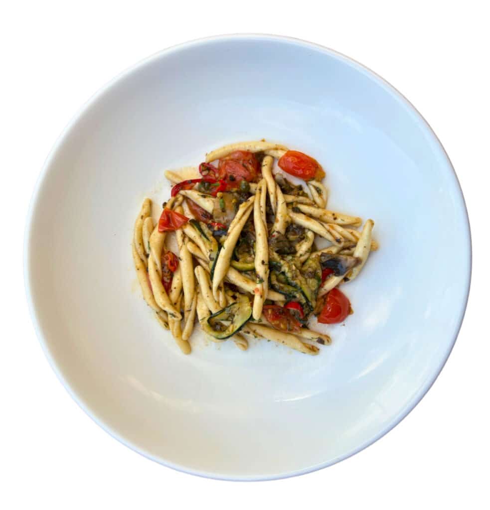 Fresh sourdough strozzaprete pasta tossed with spring vegetables in a light olive oil sauce – VEDE Pasta primavera dish